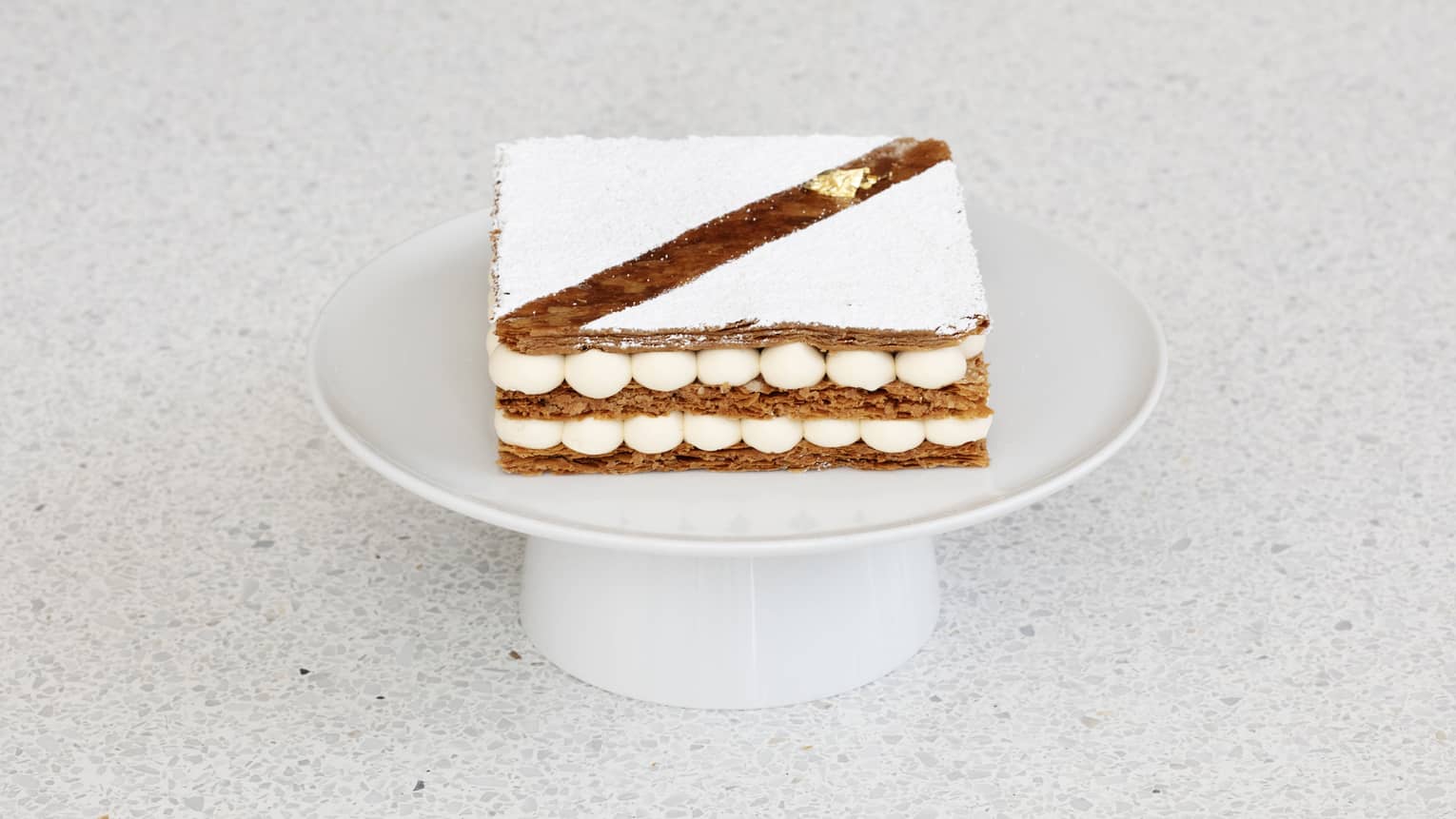 French dessert with layers of puff pastry cake and vanilla bavarois.