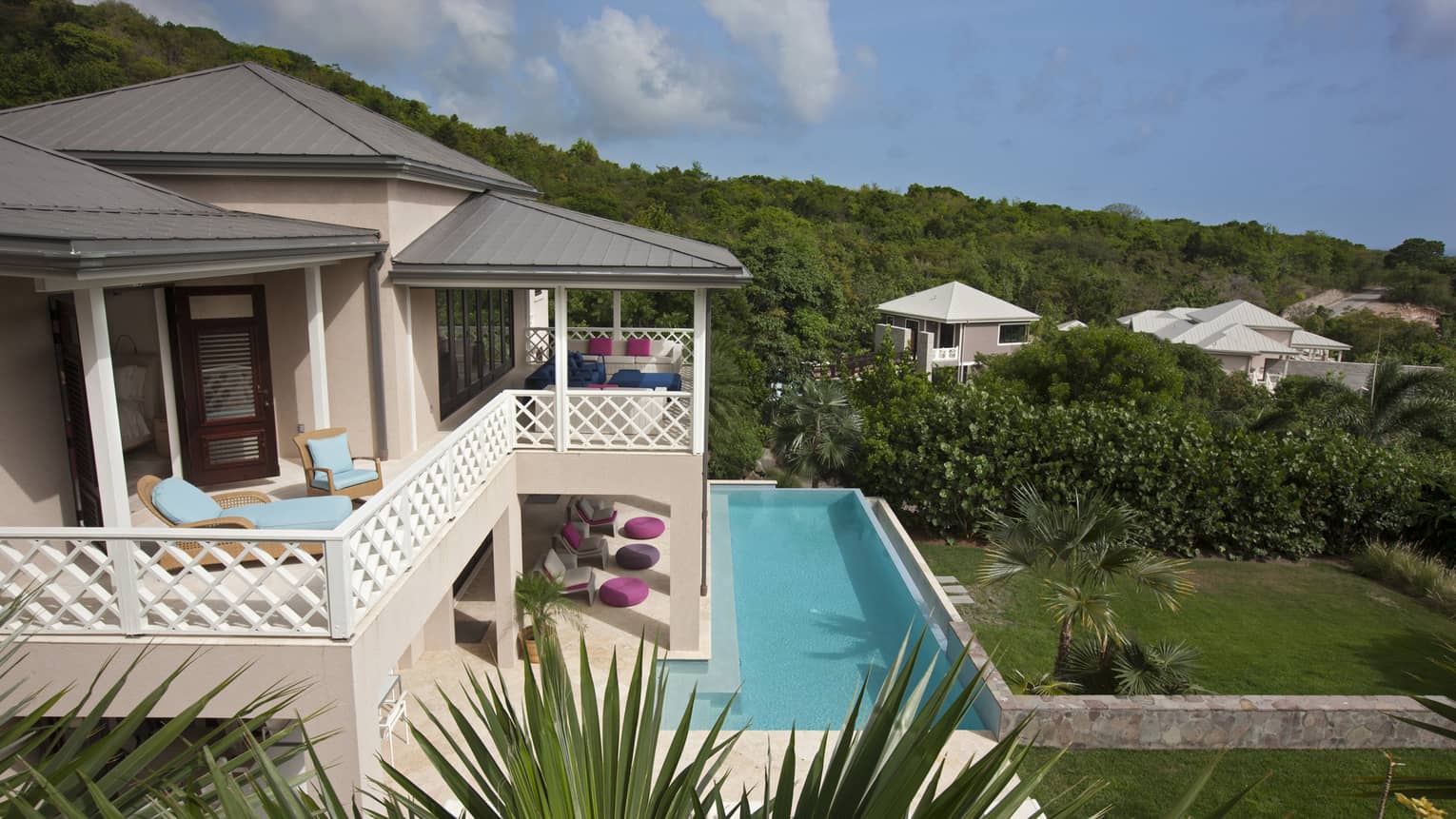 Looking down over Stewarts Residence pink exterior, upstairs balcony, outdoor pool