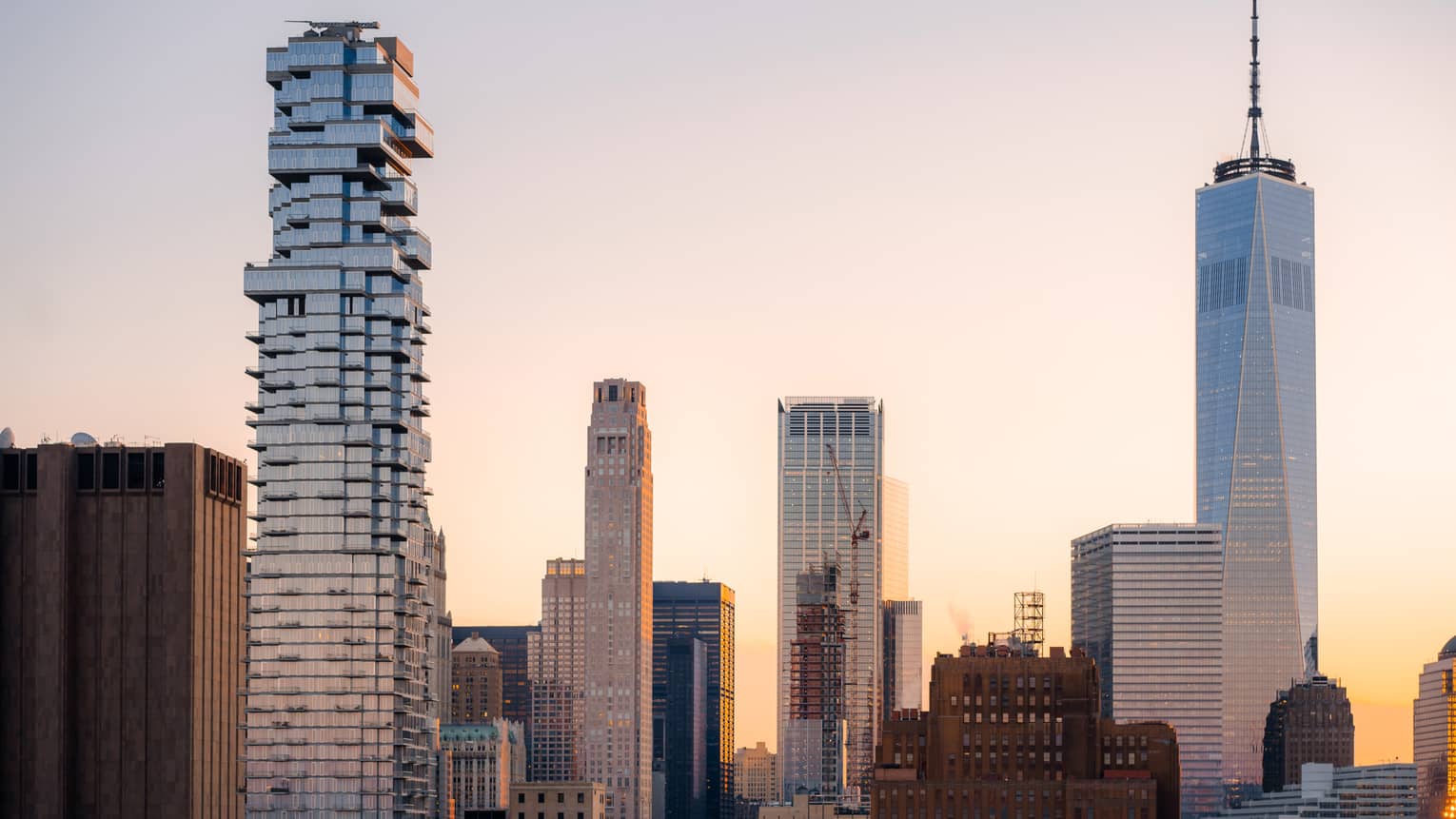 Skyscrapers in front of a sunrise.