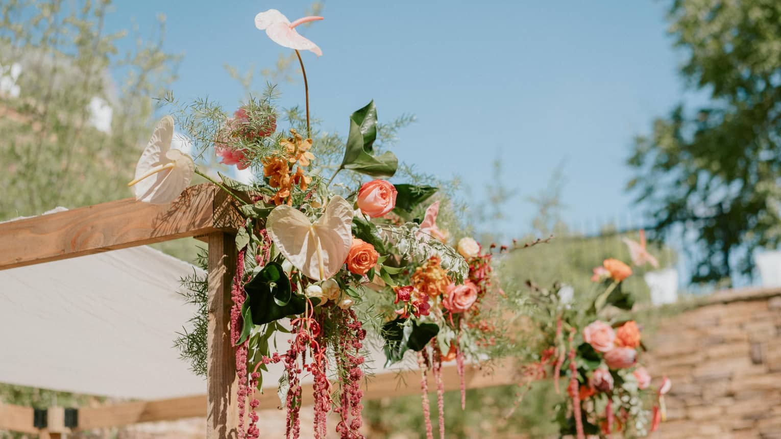 A floral arrangement at an outdoor wedding venue