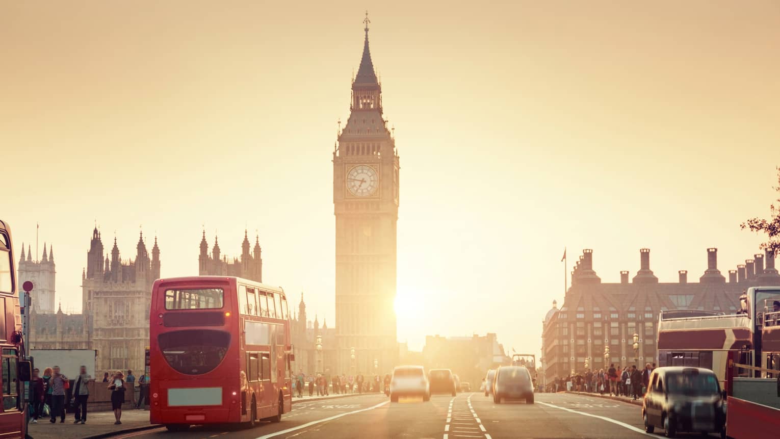Street view of London at sunset, Big Ben tower and red double-decker bus in background
