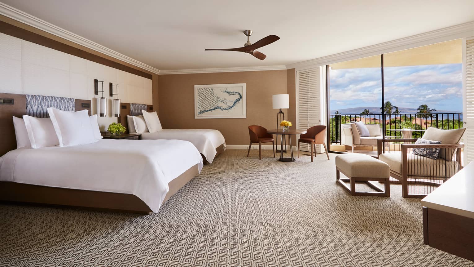 Bright Club Ocean-View Room bed with two-seat dining table, armchair and lanais with ocean view
