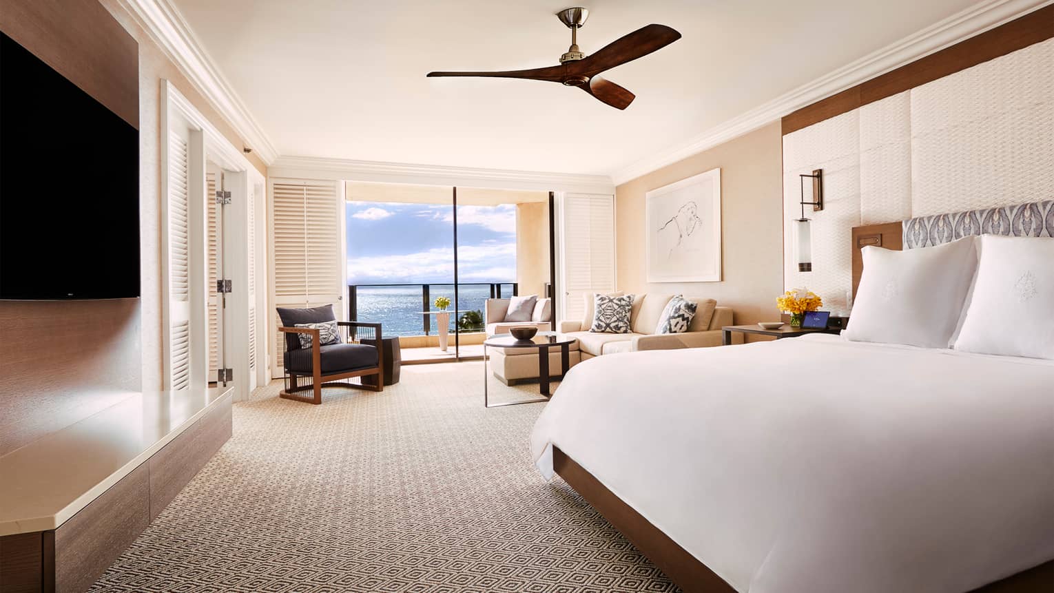 Ocean-View Prime Four Seasons Executive Suite with king-size bed, L-shaped sofa, ocean views