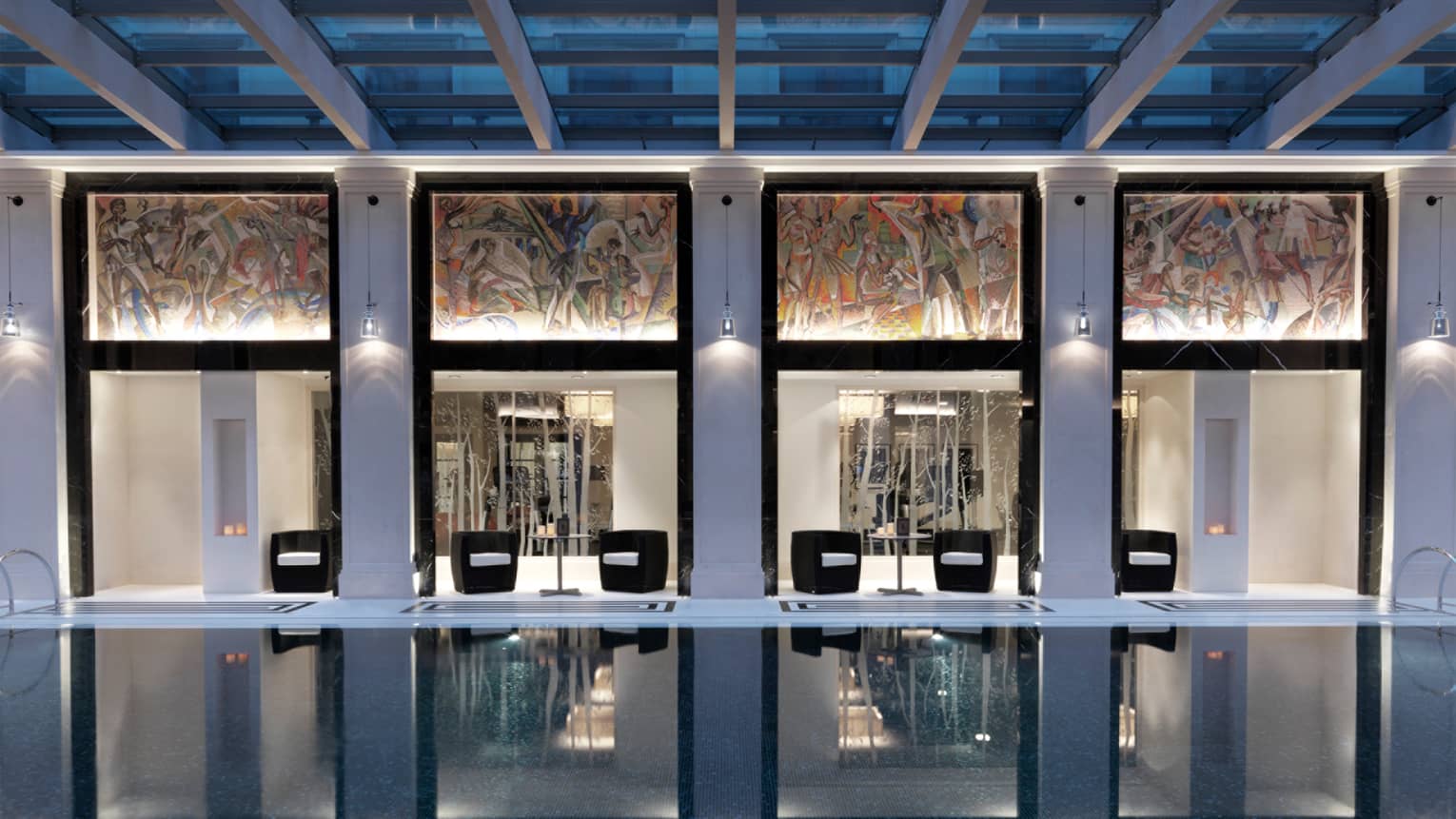 Amnis Cafe at spa with sun-lit indoor lap pool, under skylights and colourful painted wall panels