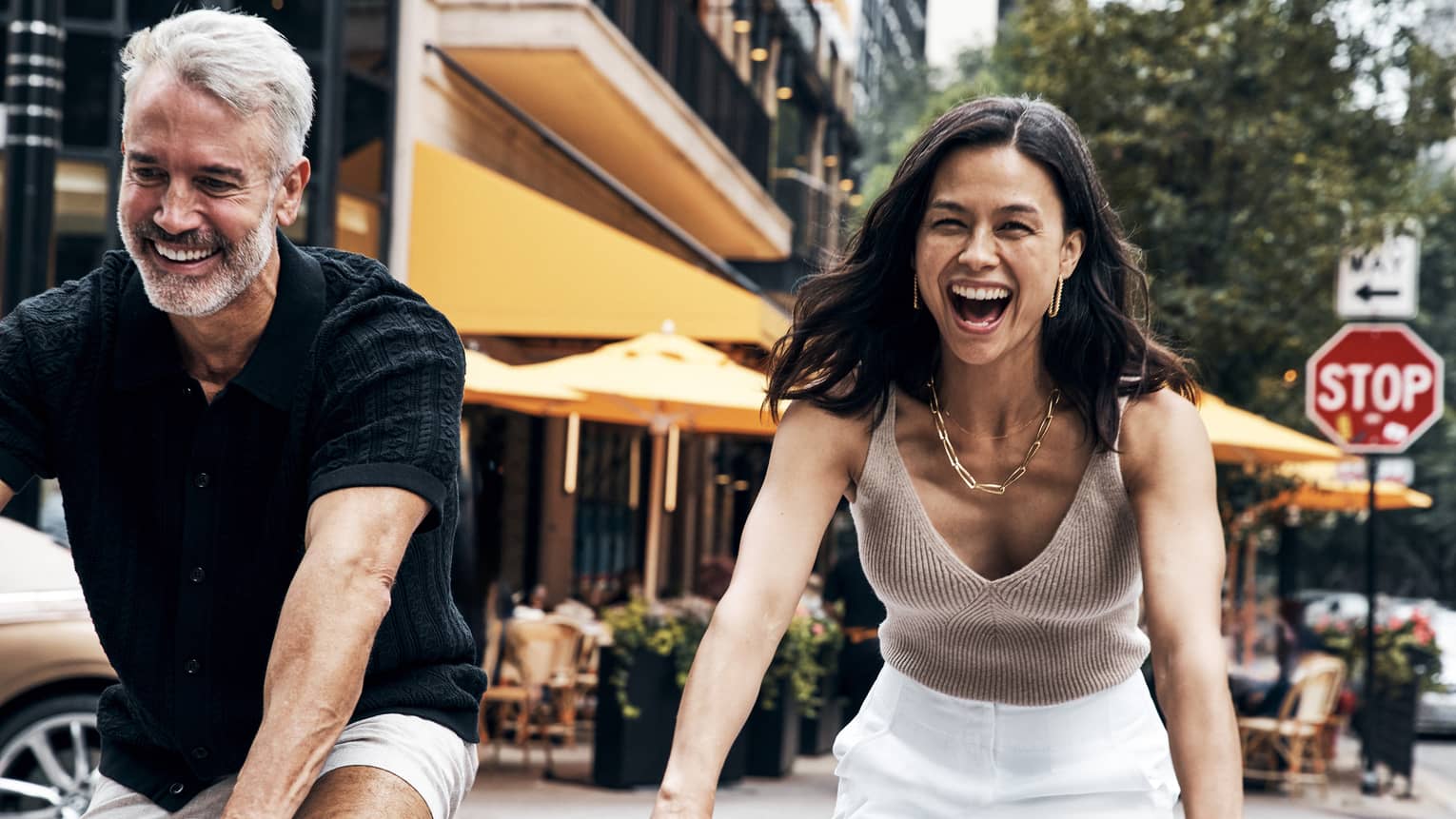 A man and woman riding bicycles.