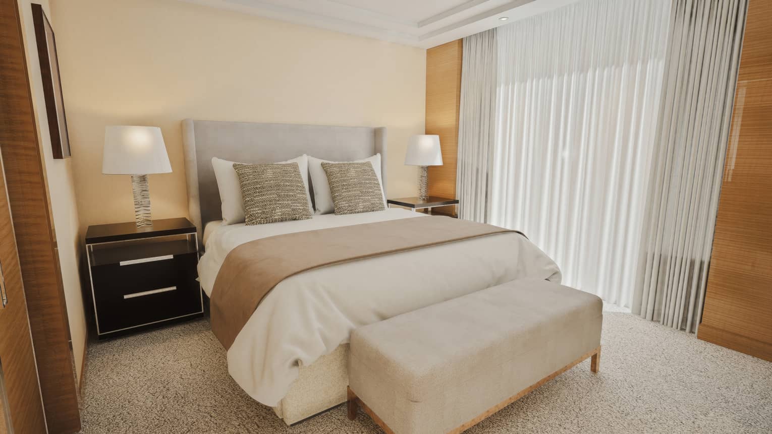 Bedroom featuring a king bed, ivory-coloured bench and bedside lamps