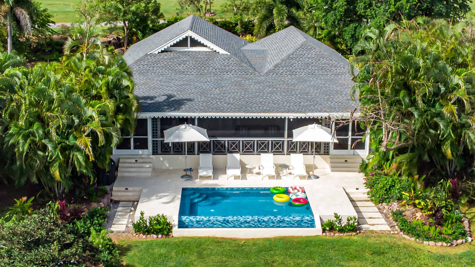 Aerial view of residence building and pool