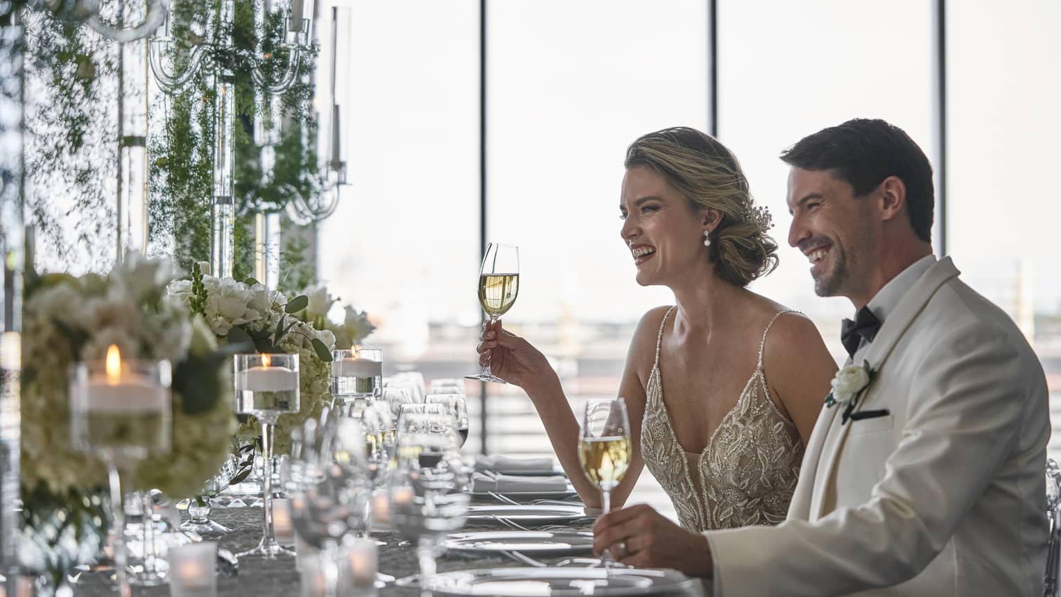 A man and woman at a wedding.