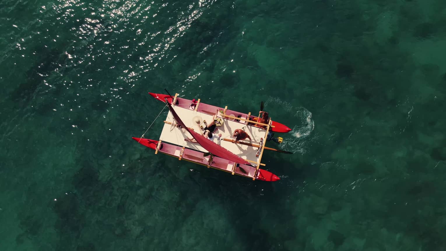 Aerial view of a Hawaiian double hull canoe on the water