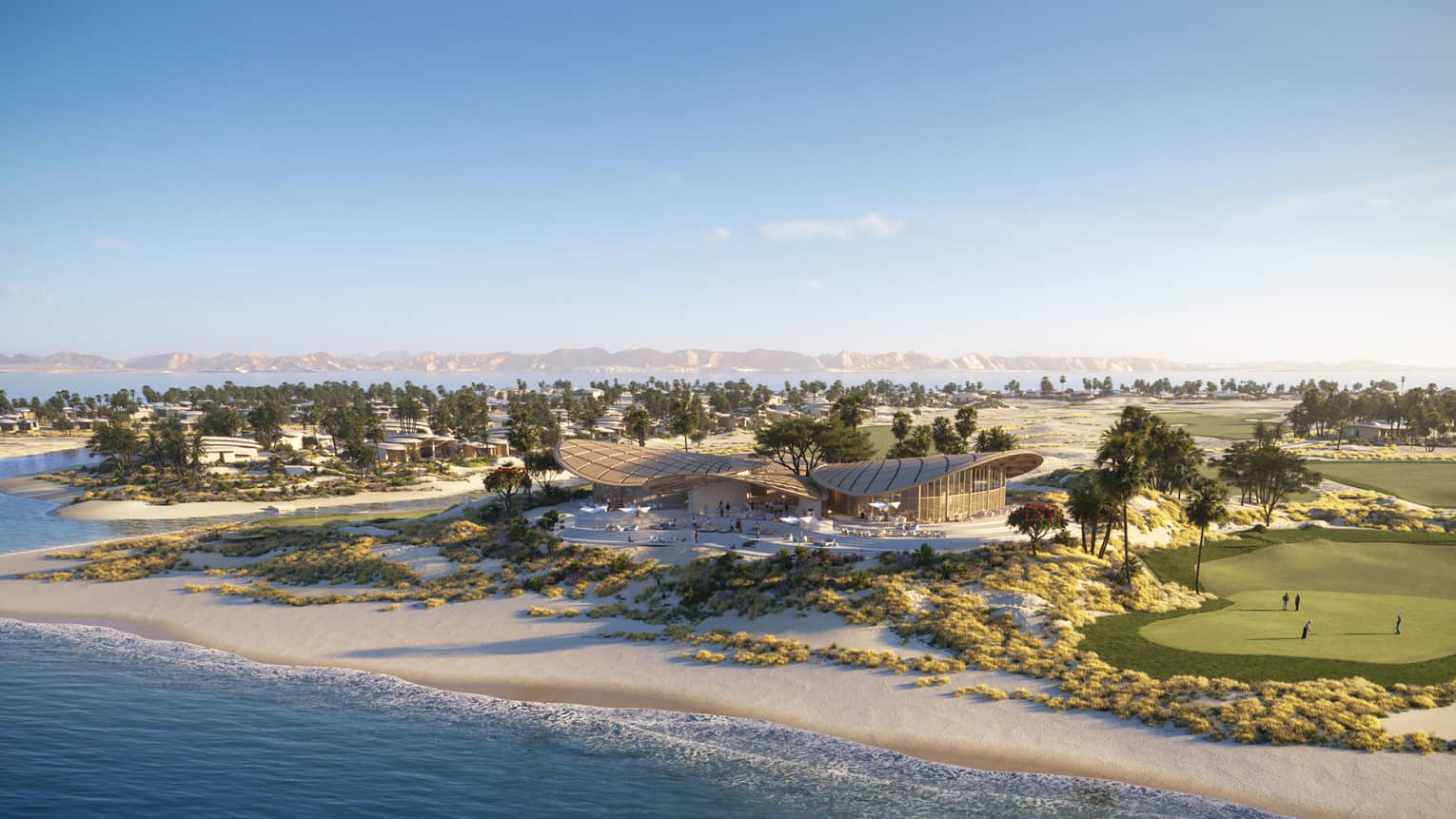 Aerial view of the clubhouse and surrounding beach and golf course