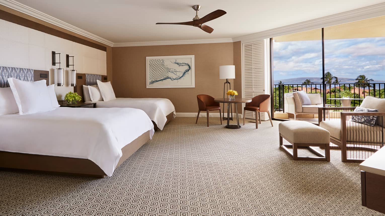 Bright Club Ocean-View Room bed with two-seat dining table, armchair and lanais with ocean view