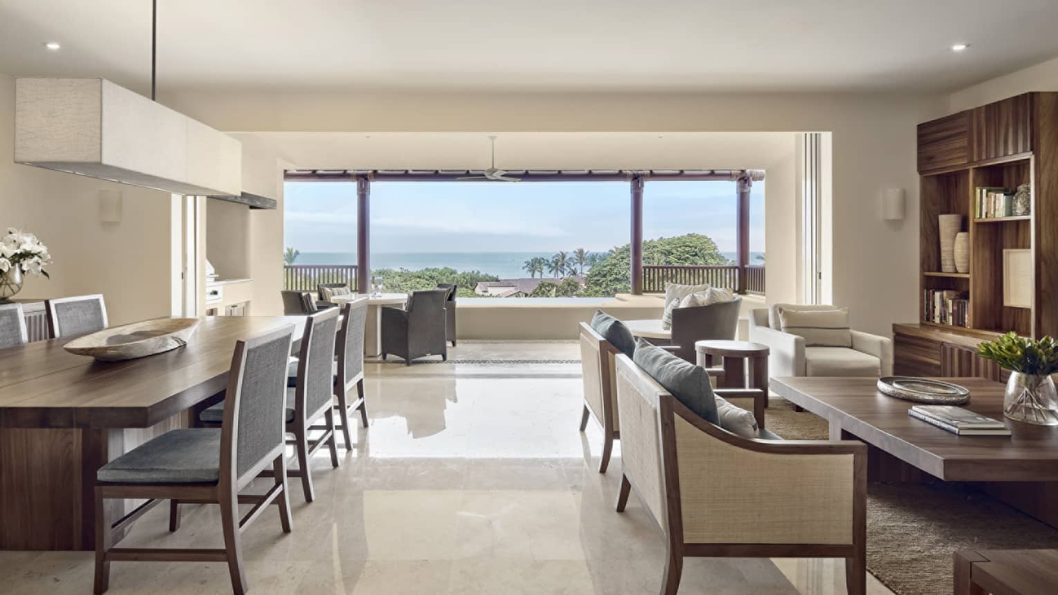 Living room and dining area with ocean view