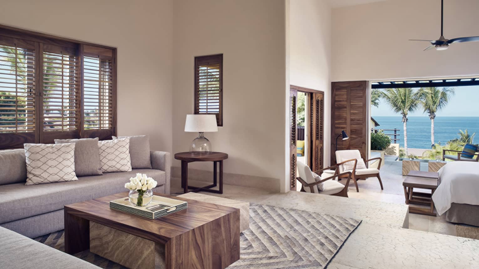 Living room with step down into king bedroom and ocean view