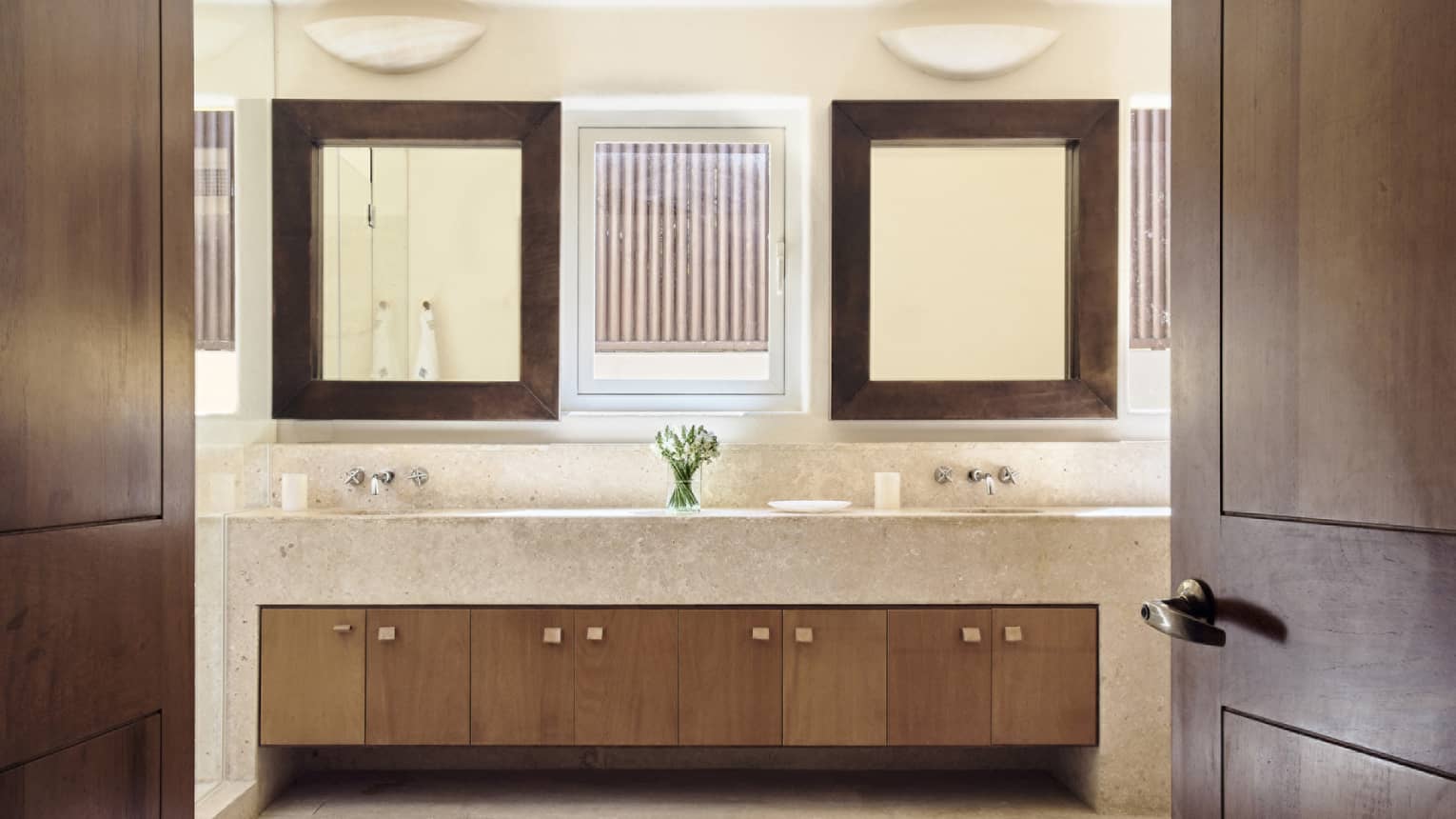 Bathroom with double vanity, two large wooden-framed mirrors