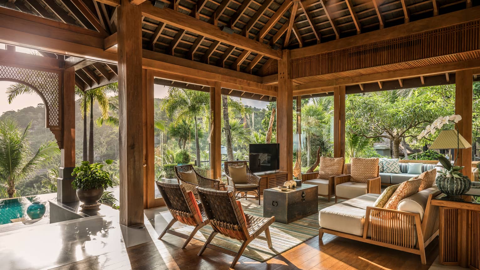 Residential terrace with seating area looking out onto the pool