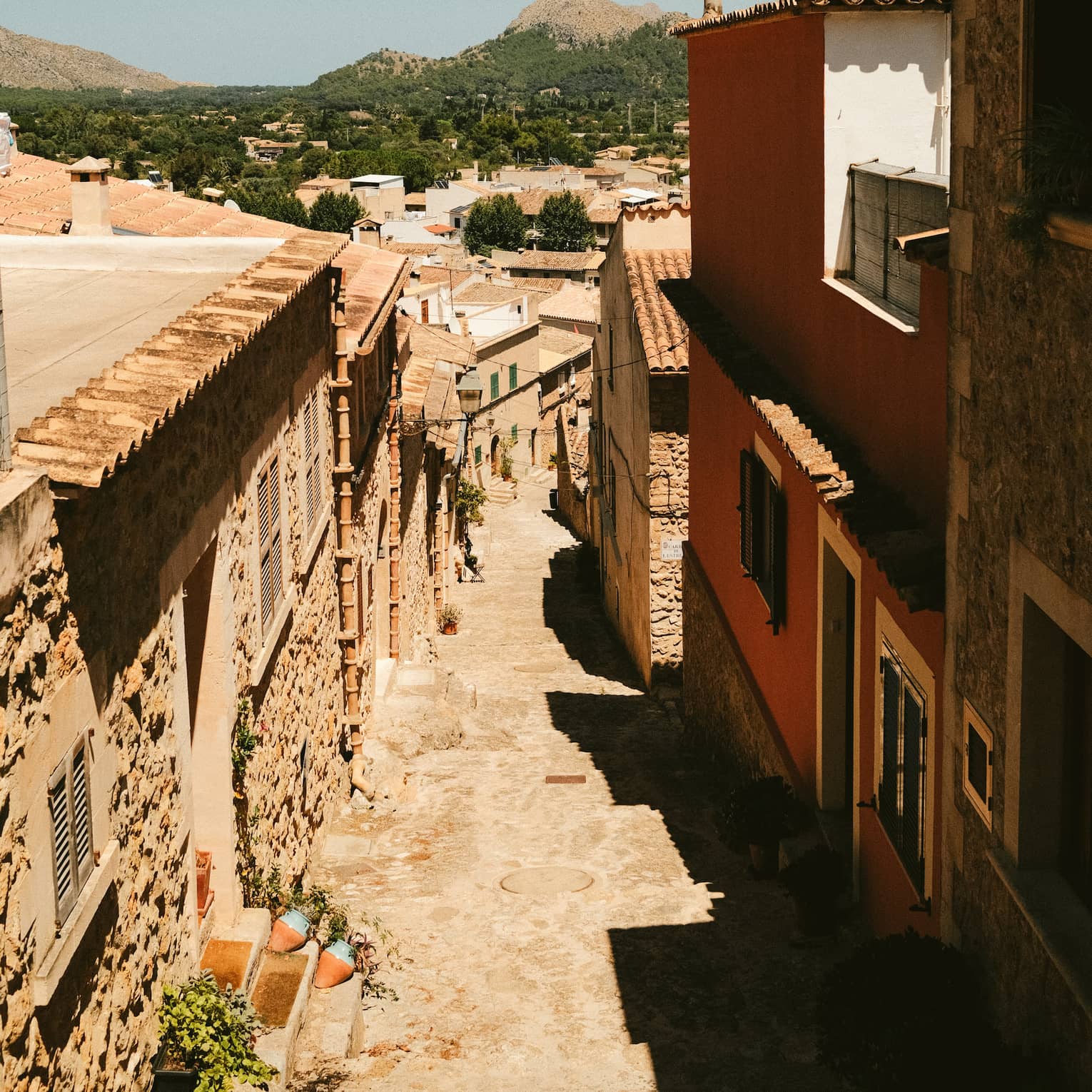 Cobblestone street lined with buildings