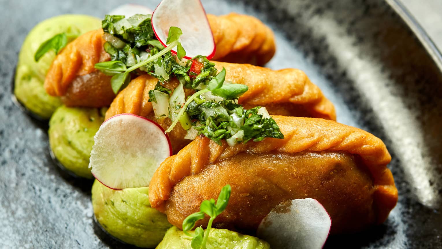 Sweet corn empanadas and avocado puree.