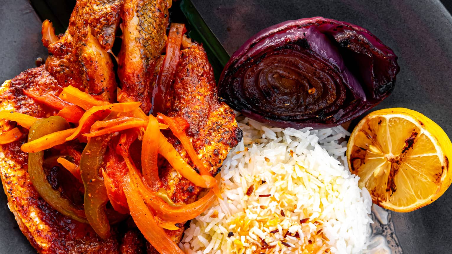 Fish with rice and lemon in a bowl