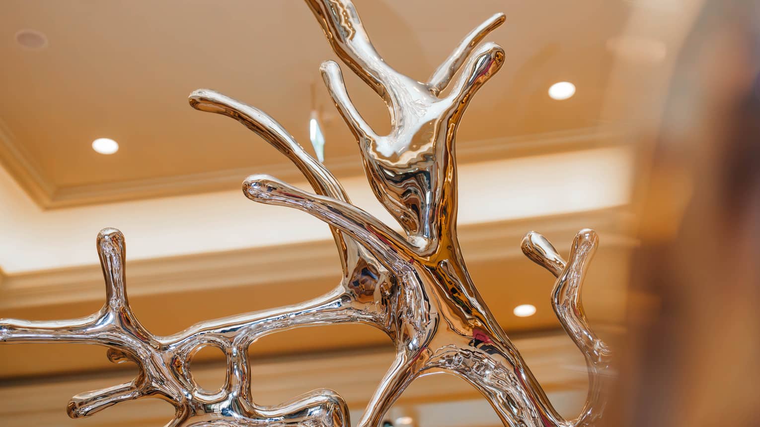 Close up of Kinetic Drop silver sculpture by Dan Pearce