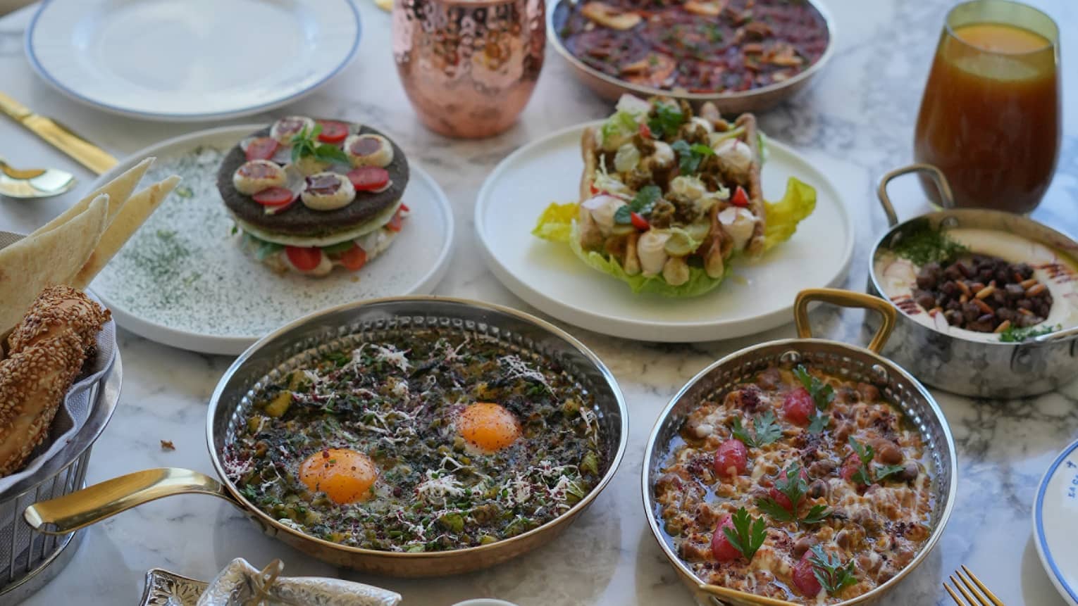 Traditional Jordinian breakfast spread set on a white marble table