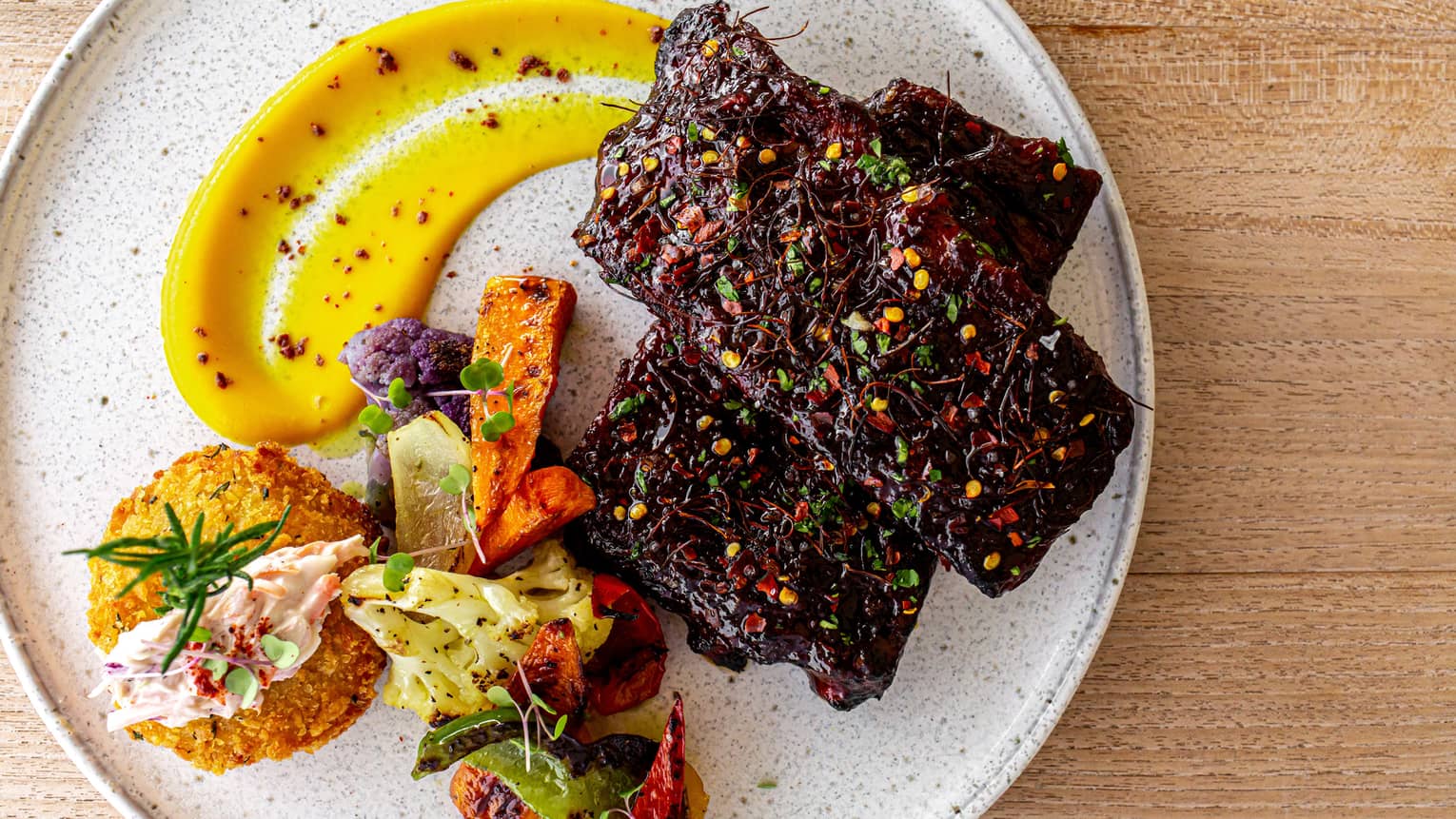 Colourful food on a white plate.