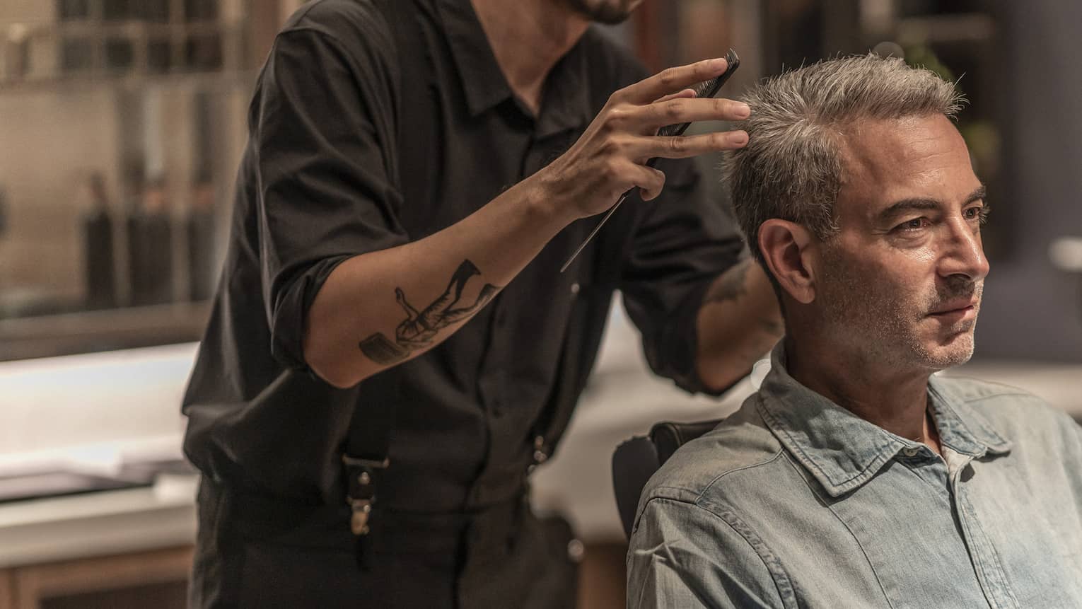Man receives haircut in the Spa's barbershop