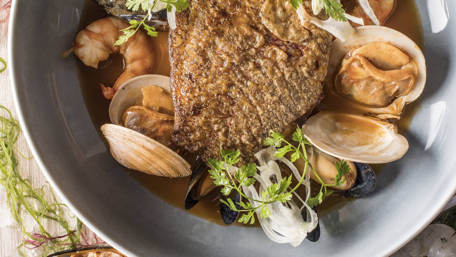 Snapper bouillabaisse with spicy diakon and lemongrass