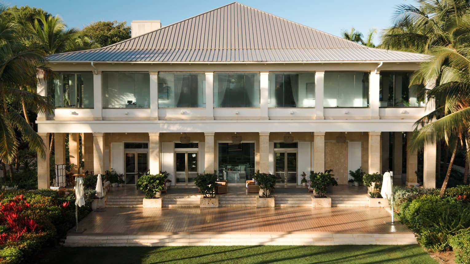 Exterior of Casa Grande building, with large green lawn