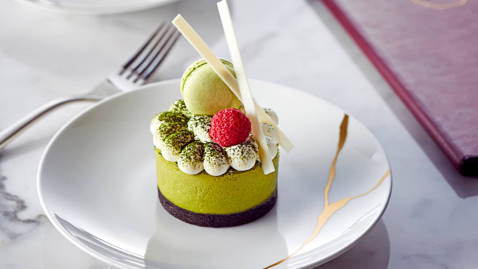 Close-up of green gourmet dessert cake by Maru menu