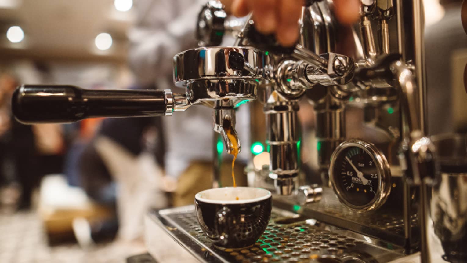 Espresso machine in use