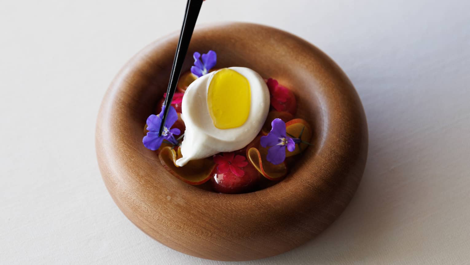 A small dish of edible flowers.