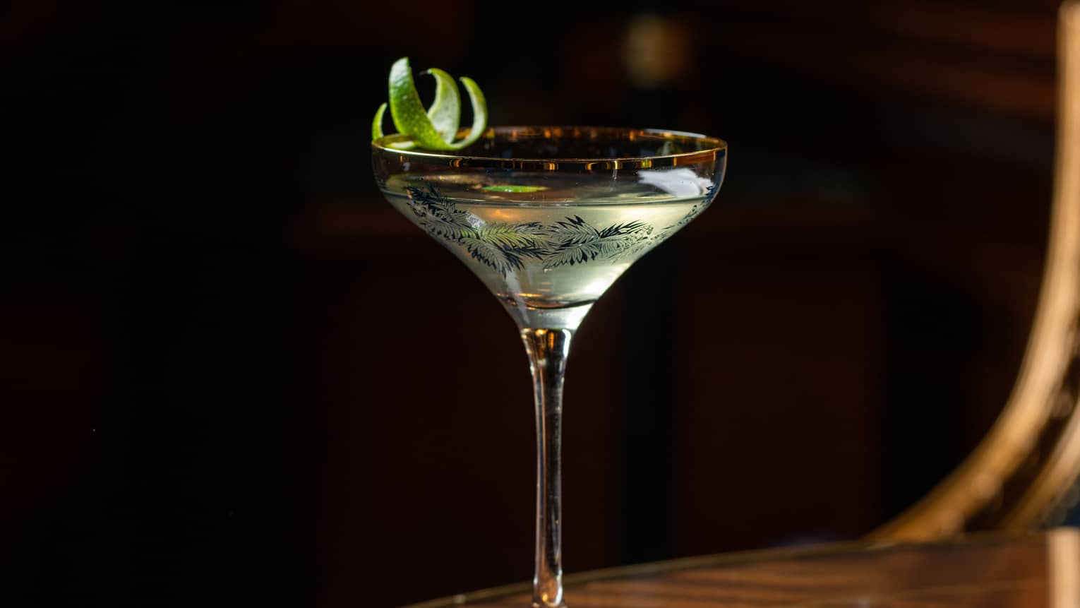 A cocktail in a stem glass.