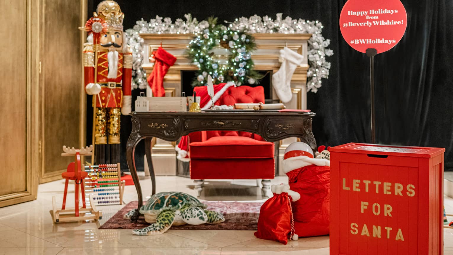A box that says Letters For Santa next to a desk.
