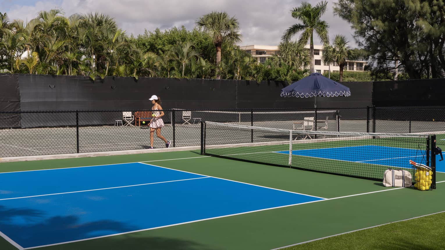 Two pickleball courts and a tennis court
