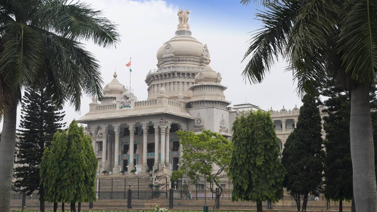 Palm trees in front of Vidhana Soudha government building exterior