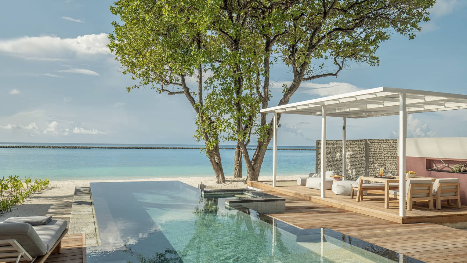 Private pool and lounge deck overlooking Maldivian ocean