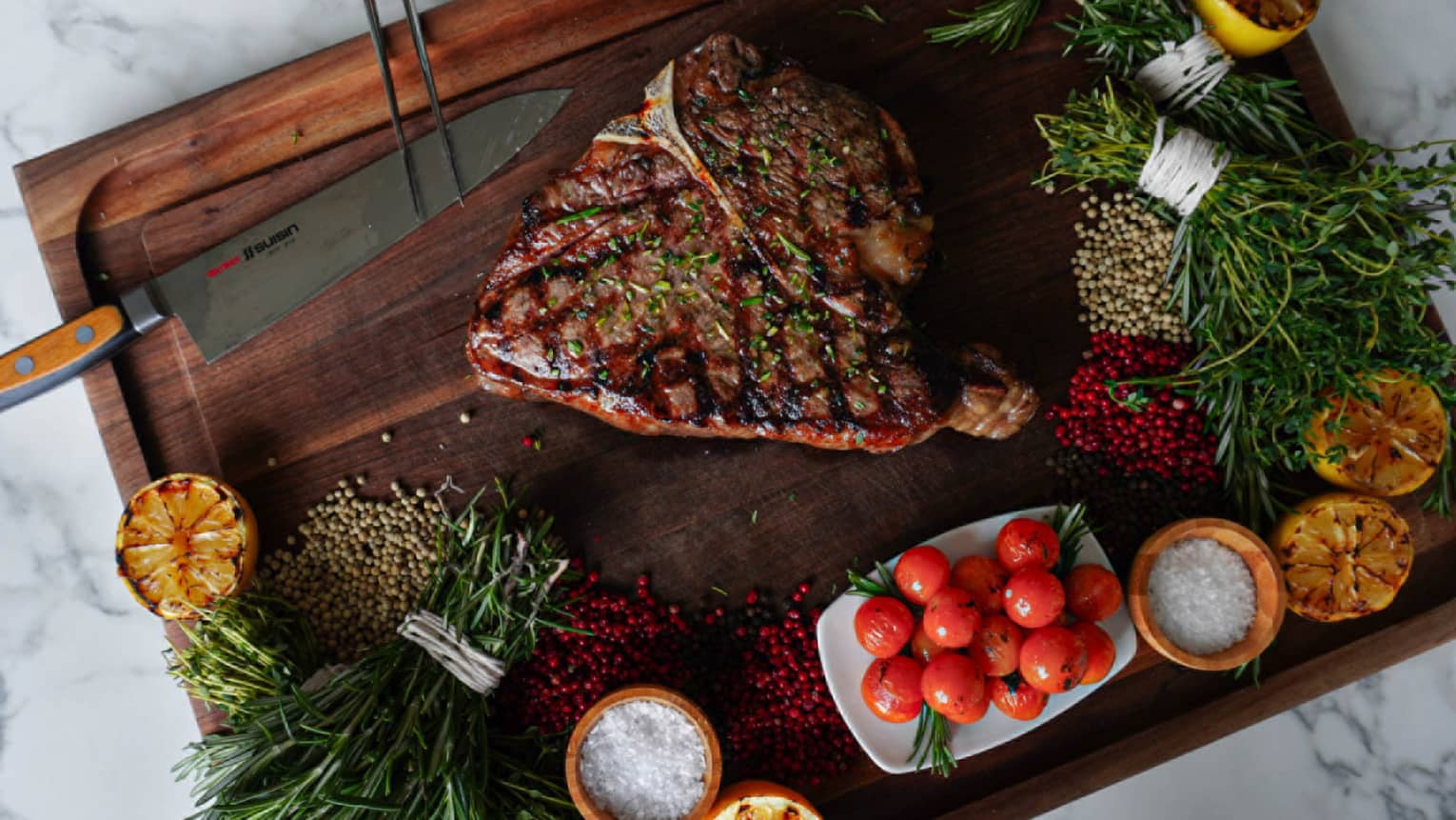 A cutting board with a slice of meat and various vegetables