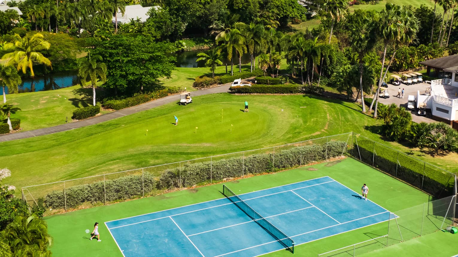 Two tennis or pickleball courts with a mountain in the background on a bright day.