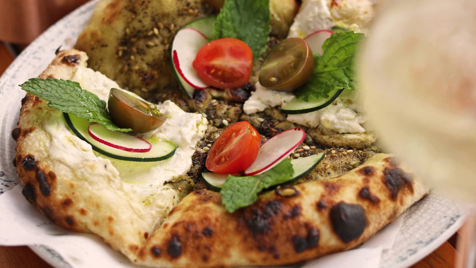 Flatbread topped with aromatic spices, fresh herbs and olive oil