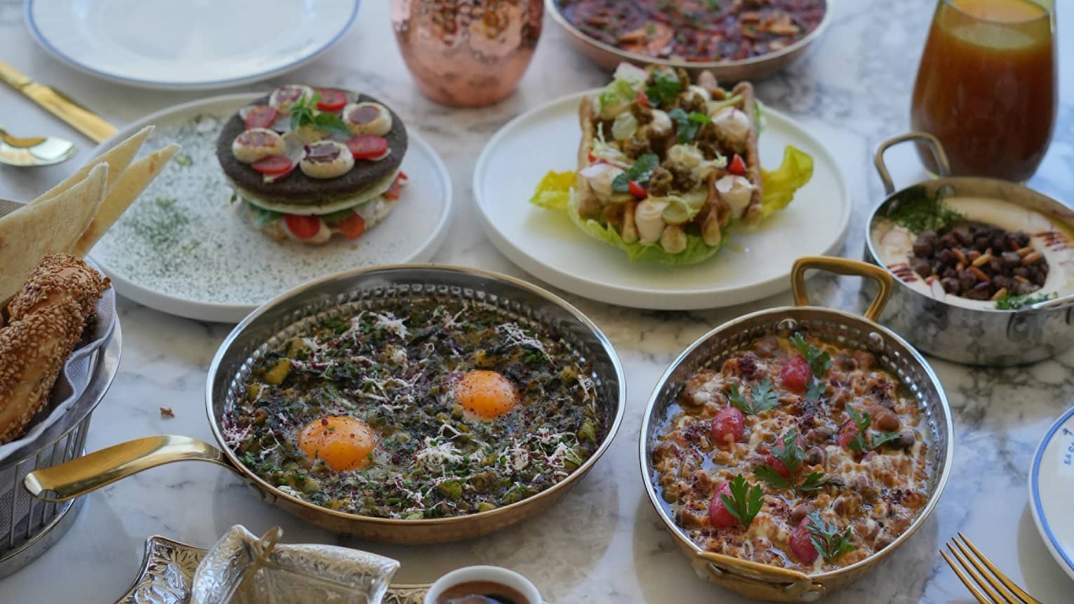 Traditional Jordinian breakfast spread set on a white marble table