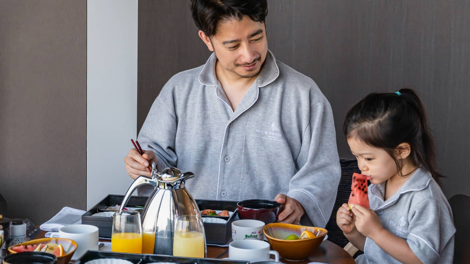 Man and his daughter enjoy In-Room Dining breakfast