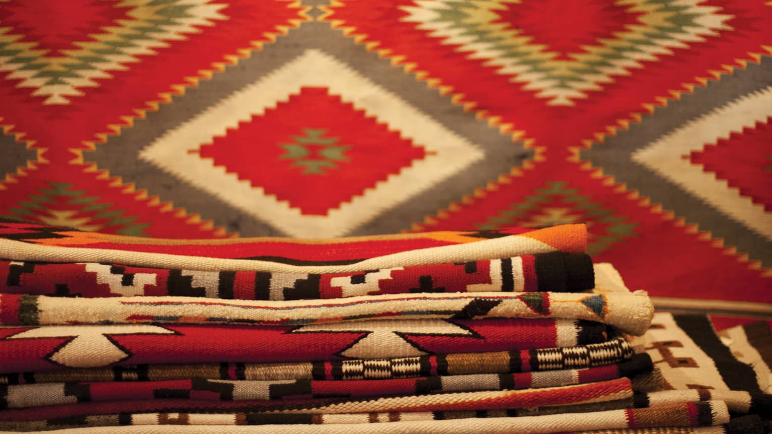 Stack of colourful folded fabrics