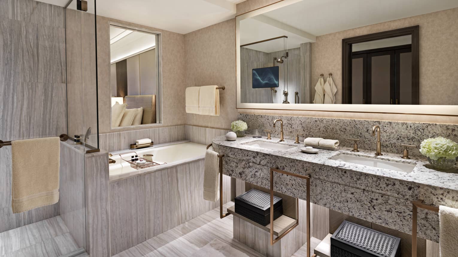 Bathroom with double vanity sinks, tun and separate walk-in shower