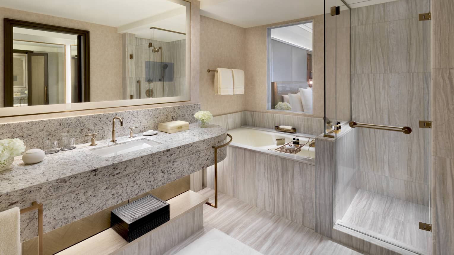 Bathroom with long vanity, tub and separate shower
