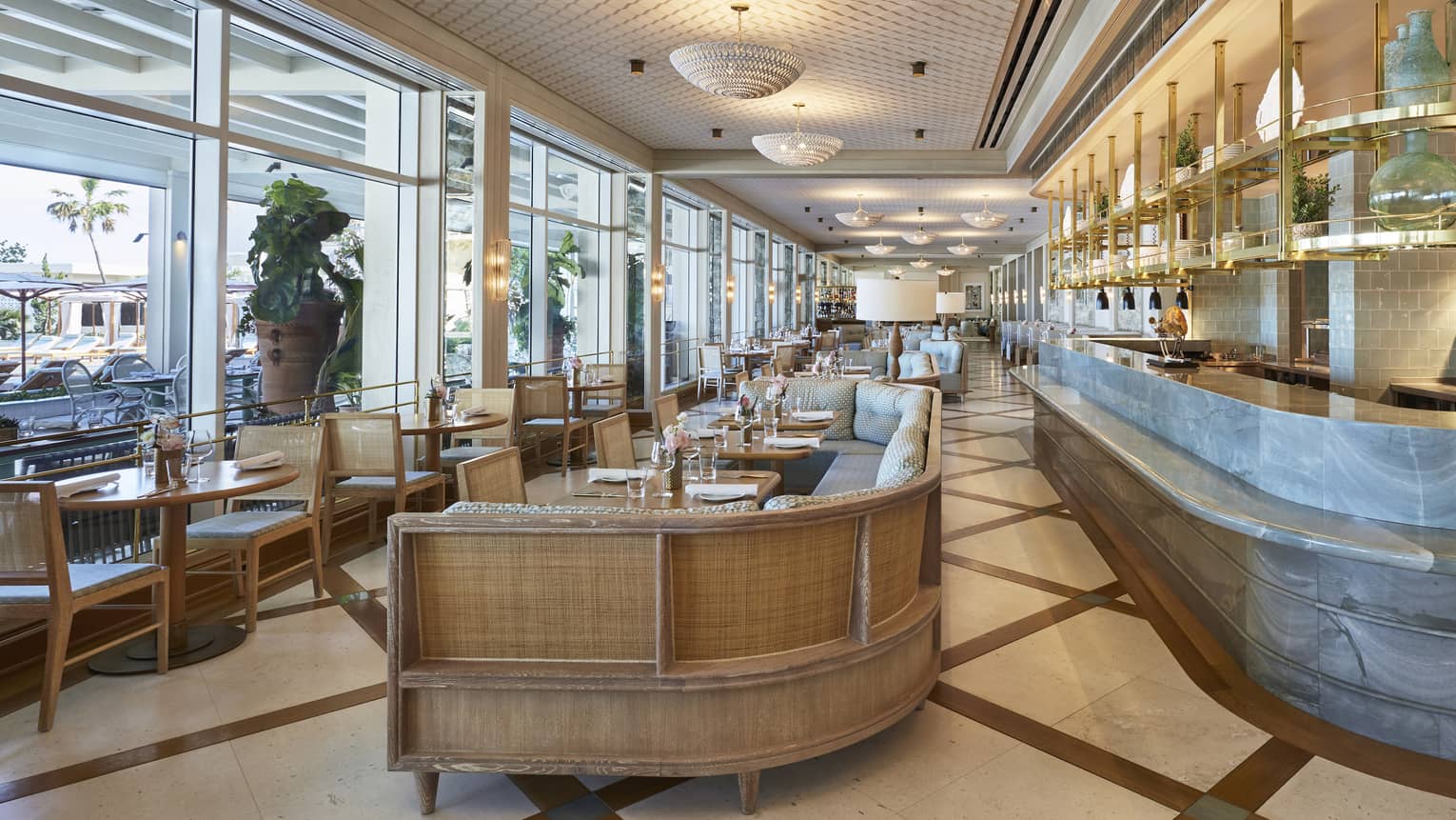 Florie’s restaurant wall of windows, dining room tables, banquettes and marble bar