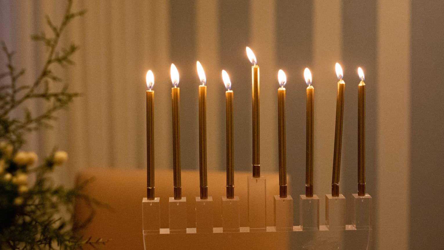 A menorah on a wood table.