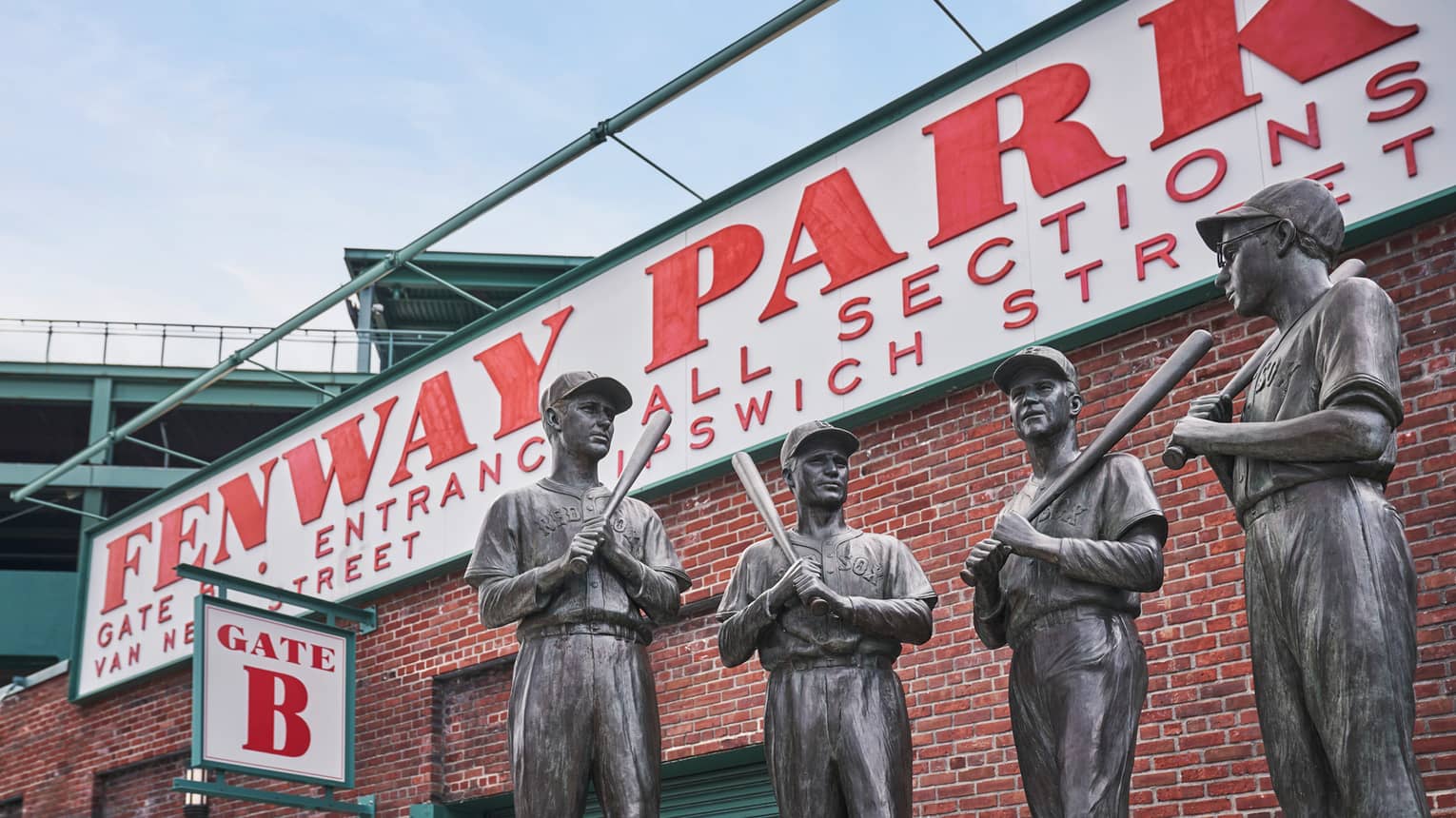 In front of Fenway Park’s Gate 5 is a bronze statue, called The Teammates, of four former Red Sox players in their uniforms.