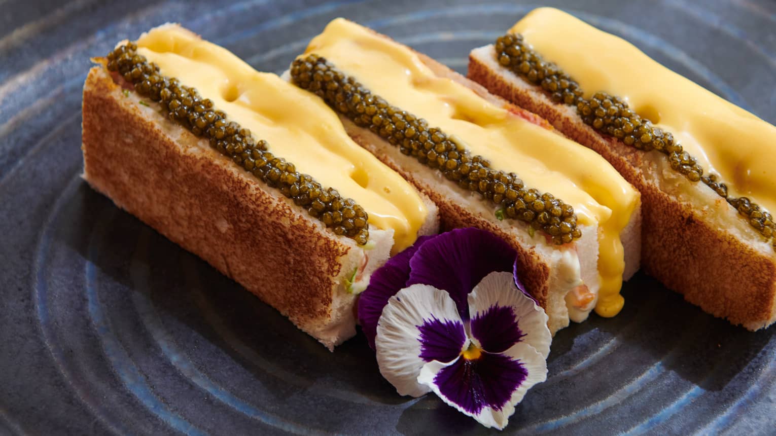 Dani's Club Sandwich with Free-Range Chicken, Norwegian Salmon, Baeri Caviar, and Hollandaise Sauce