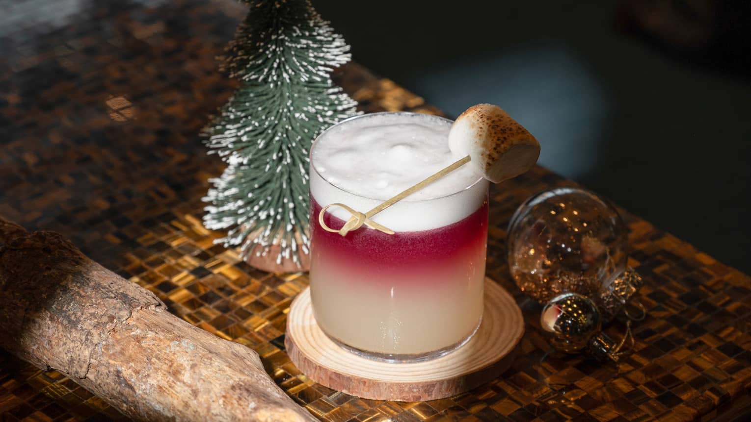 Festive cocktail at Bar Trigona with snow-tipped fir tree dec�r