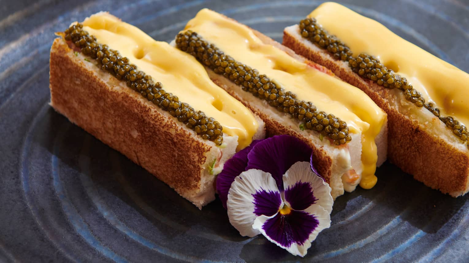 Dani's Club Sandwich with Free-Range Chicken, Norwegian Salmon, Baeri Caviar, and Hollandaise Sauce